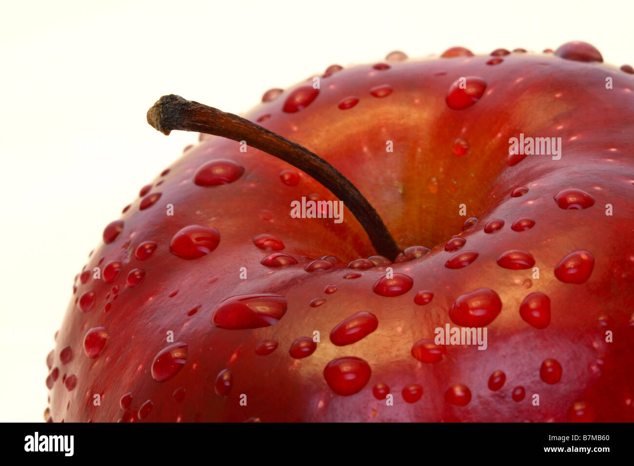 Apple with water droplets. American 'Red Delicious' variety Stock Photo