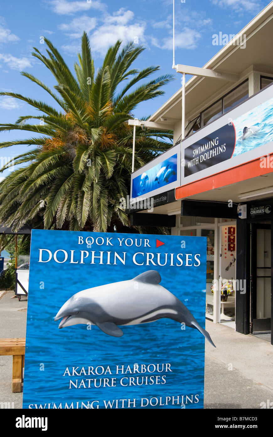 Dolphin Cruises sign, Beach Road, Akaroa, Banks Peninsula, Canterbury, New Zealand Stock Photo