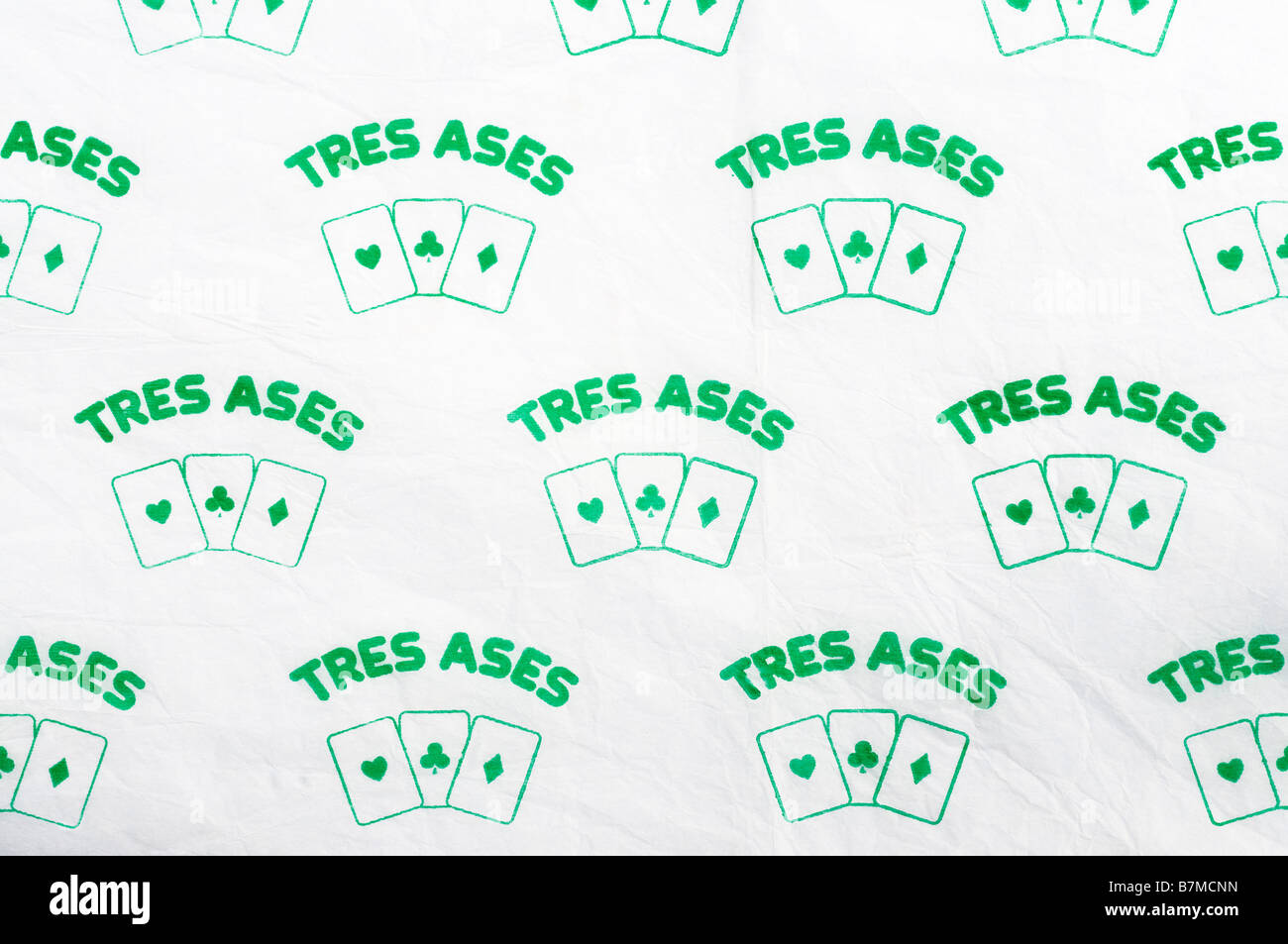Printed ephemera / Citrus fruit wrapper from Spain - 3 Aces 'Tres Ases' Playing Cards illustration on tissue paper. Stock Photo
