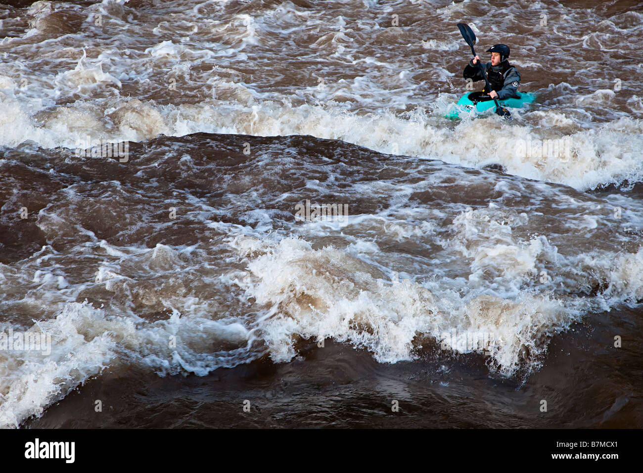 Person in kayak in white water River Usk Llangynidr Wales UK Stock Photo