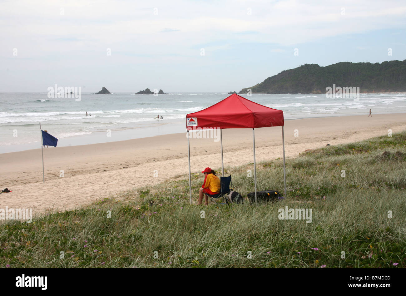 A surf life saver keeps a lonely vigil at Tallow beach near Broken Head Australia Stock Photo