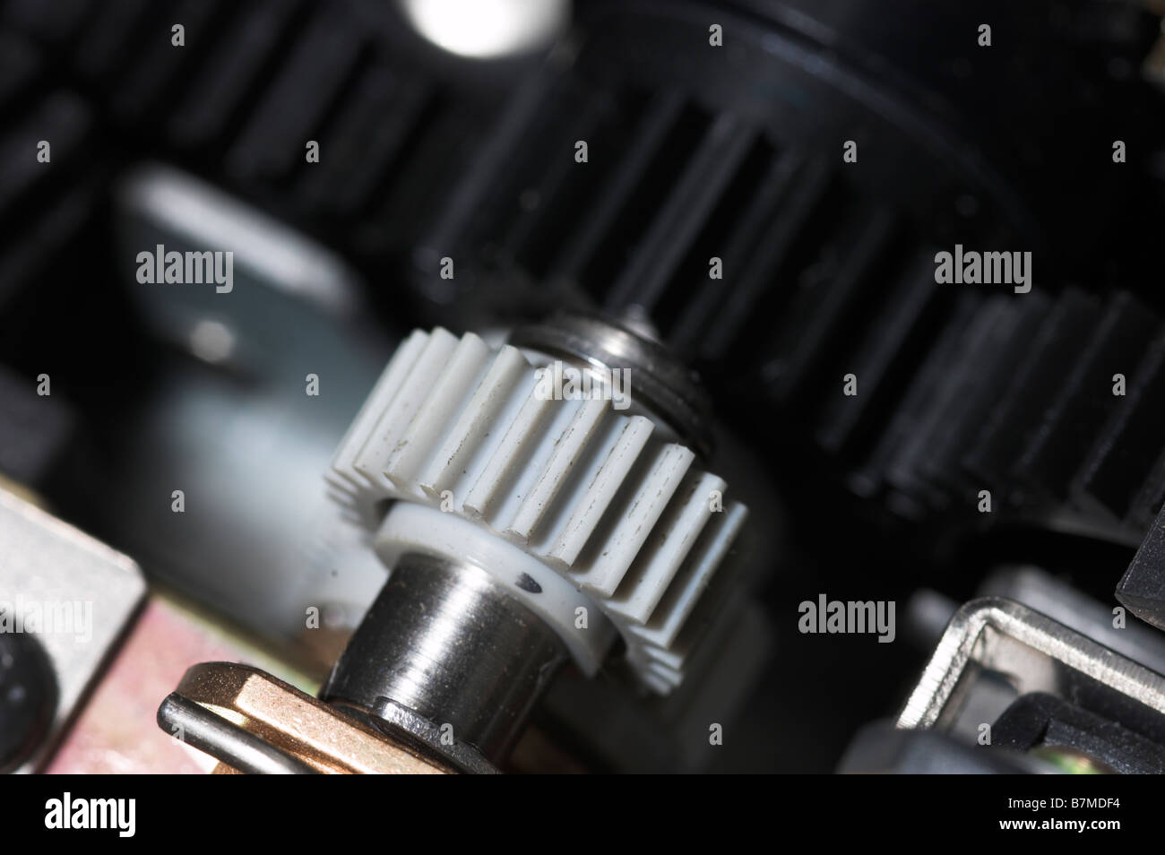 inkjet printer paper feeder mechanical drive. four external spur gear  wheels with different gear ratios. reducer of plastic cogwheels. with  clipping p Stock Photo - Alamy