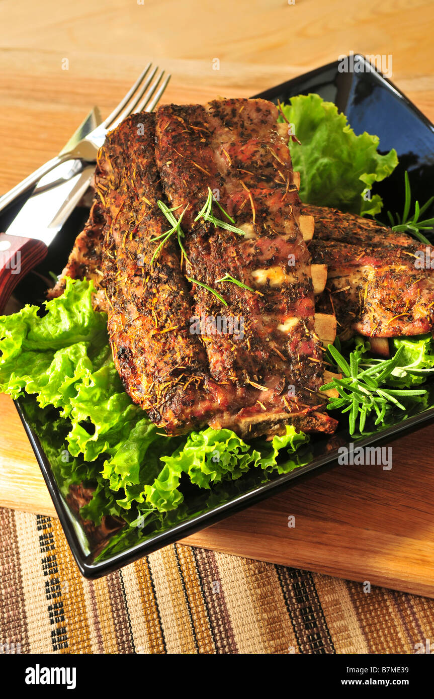 Plate of spare ribs and greens for dinner Stock Photo