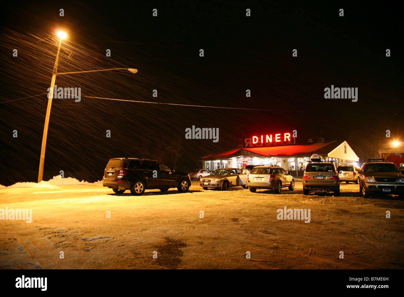 Diner illuminated at night in a snowstorm, Chatham, NY, USA Stock Photo