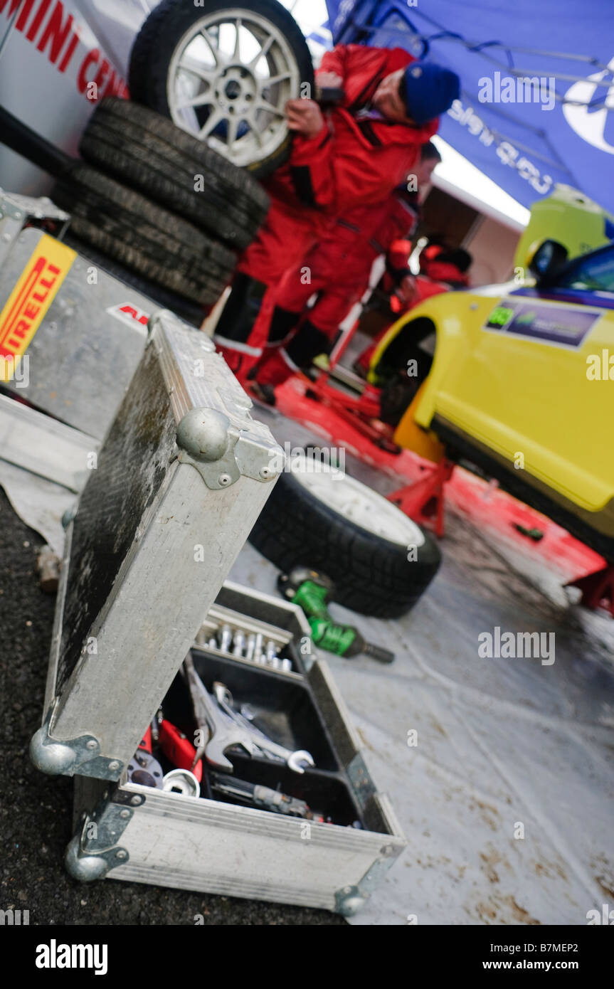 Mechanic works on wheel vehicle hi-res stock photography and