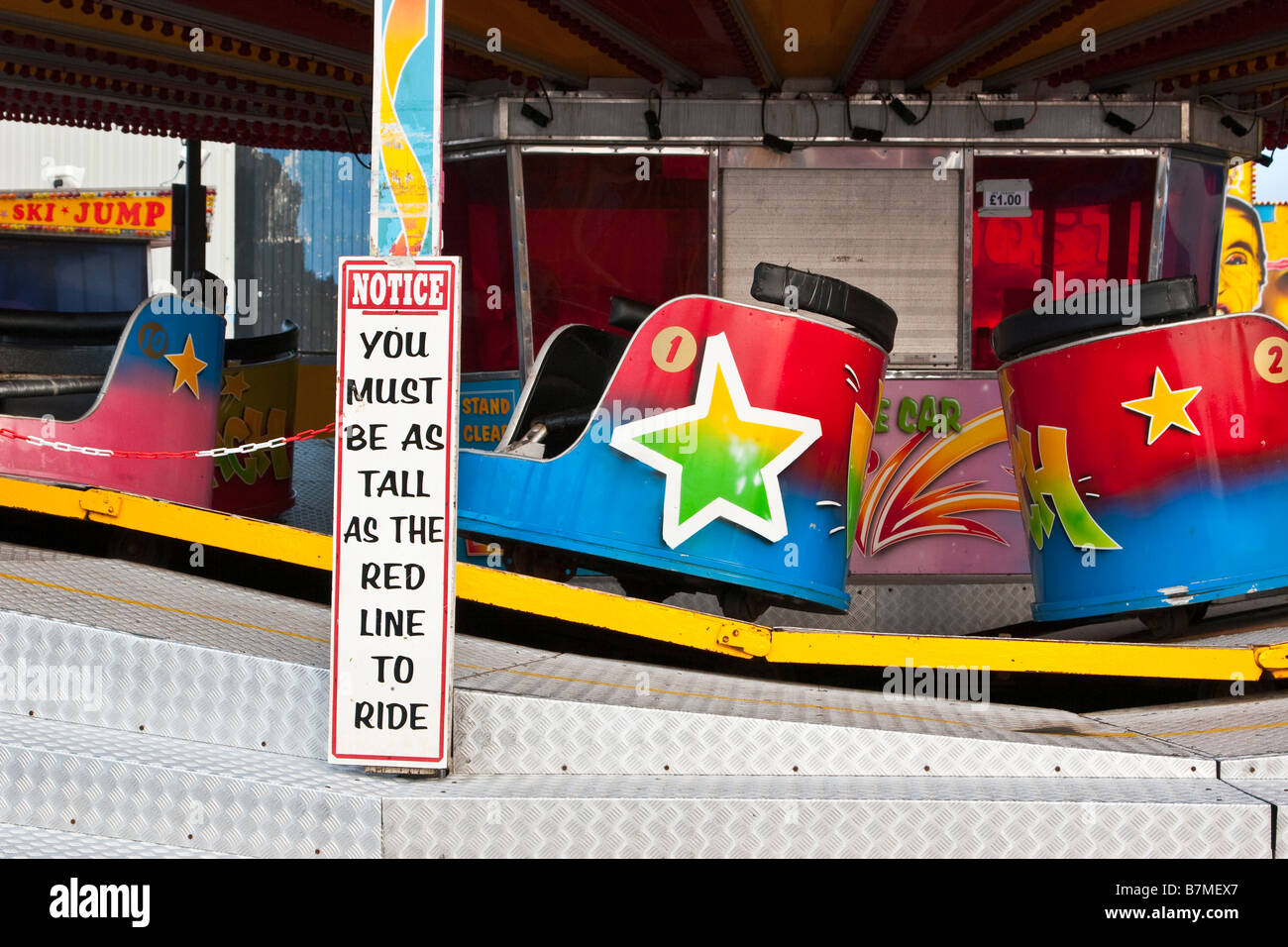 Fairground waltzers ride with minimum height safety notice Stock Photo ...