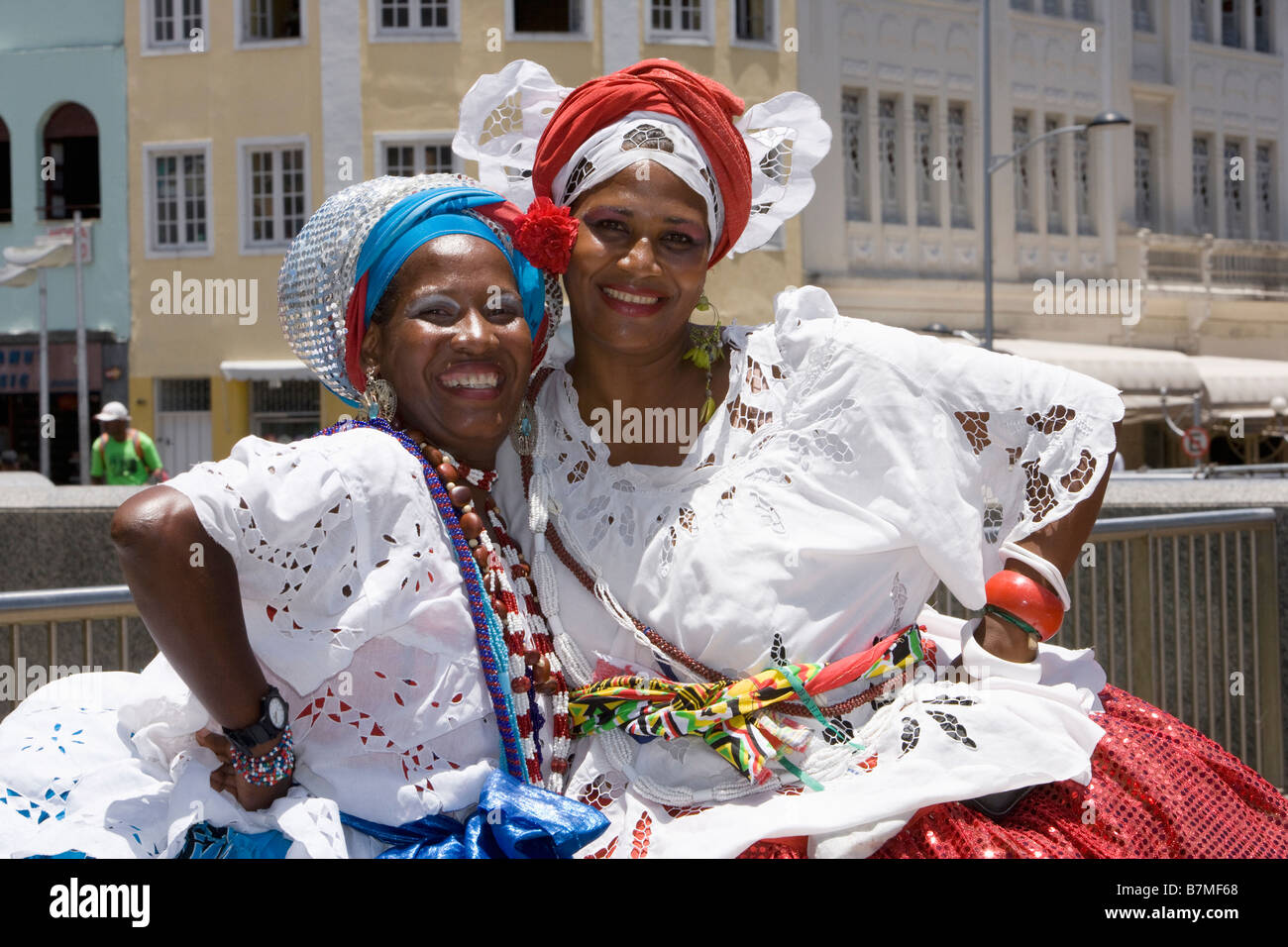 Smiling young woman wearing Brazilian national dress dancing for ...