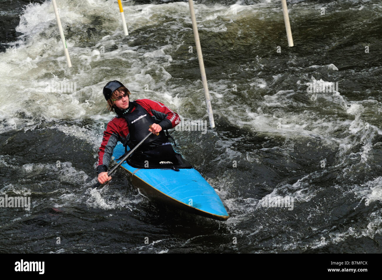 man paddling turbulent water canoe Stock Photo