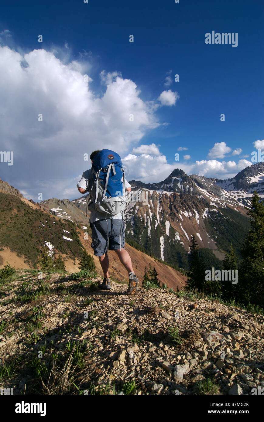a backpacker hikes on a high mountain ridge in the san juan mountains near telluride colorado Stock Photo