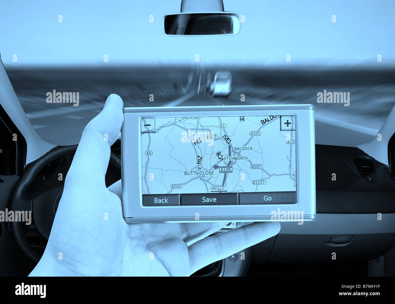 GPS Vehicle navigation system in a man hand Stock Photo Alamy