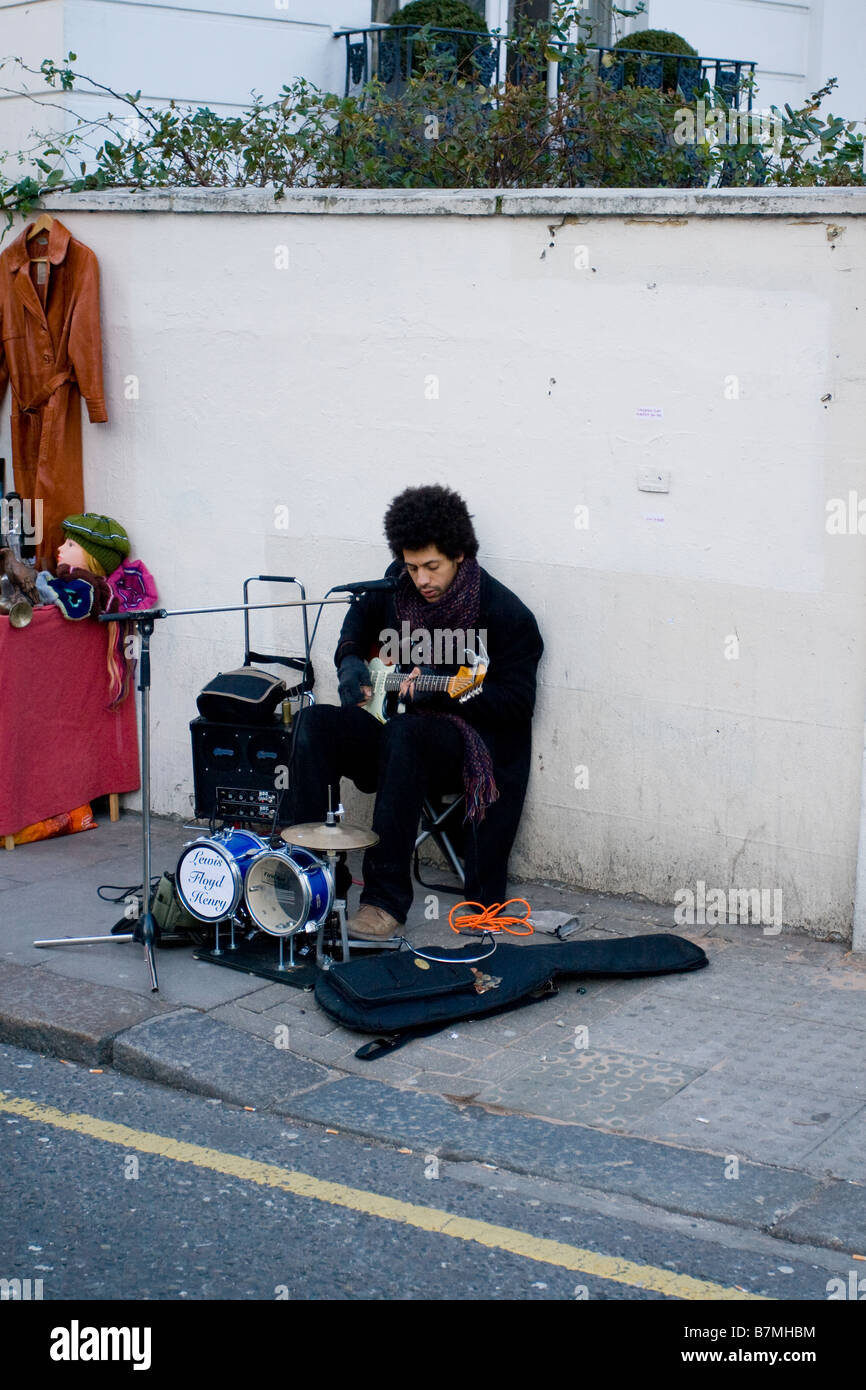Busker on Portobello Road, Notting Hill, London, England, UK Stock Photo