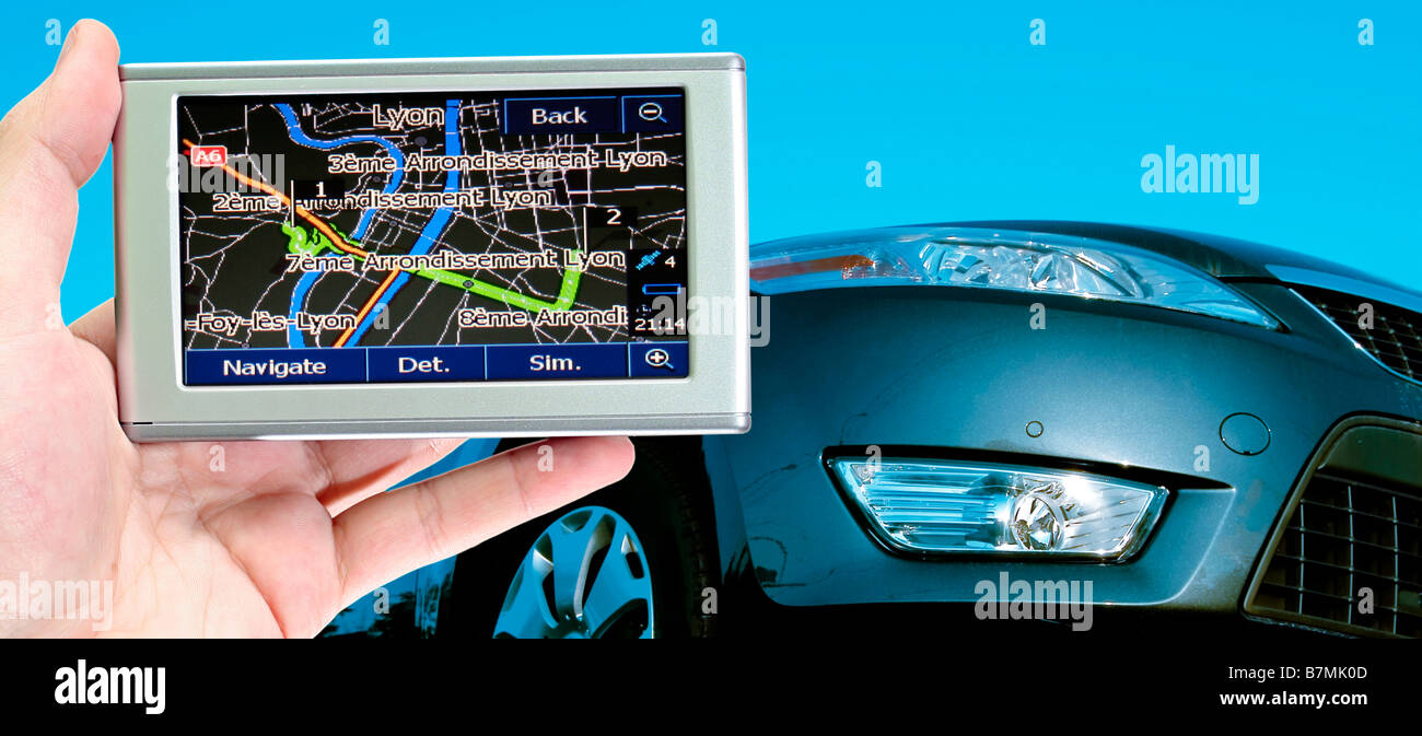 great car isolated on blue gps in a man hand Stock Photo