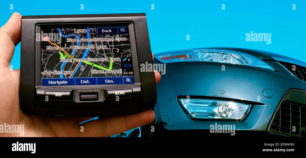 great car isolated on blue gps in a man hand Stock Photo