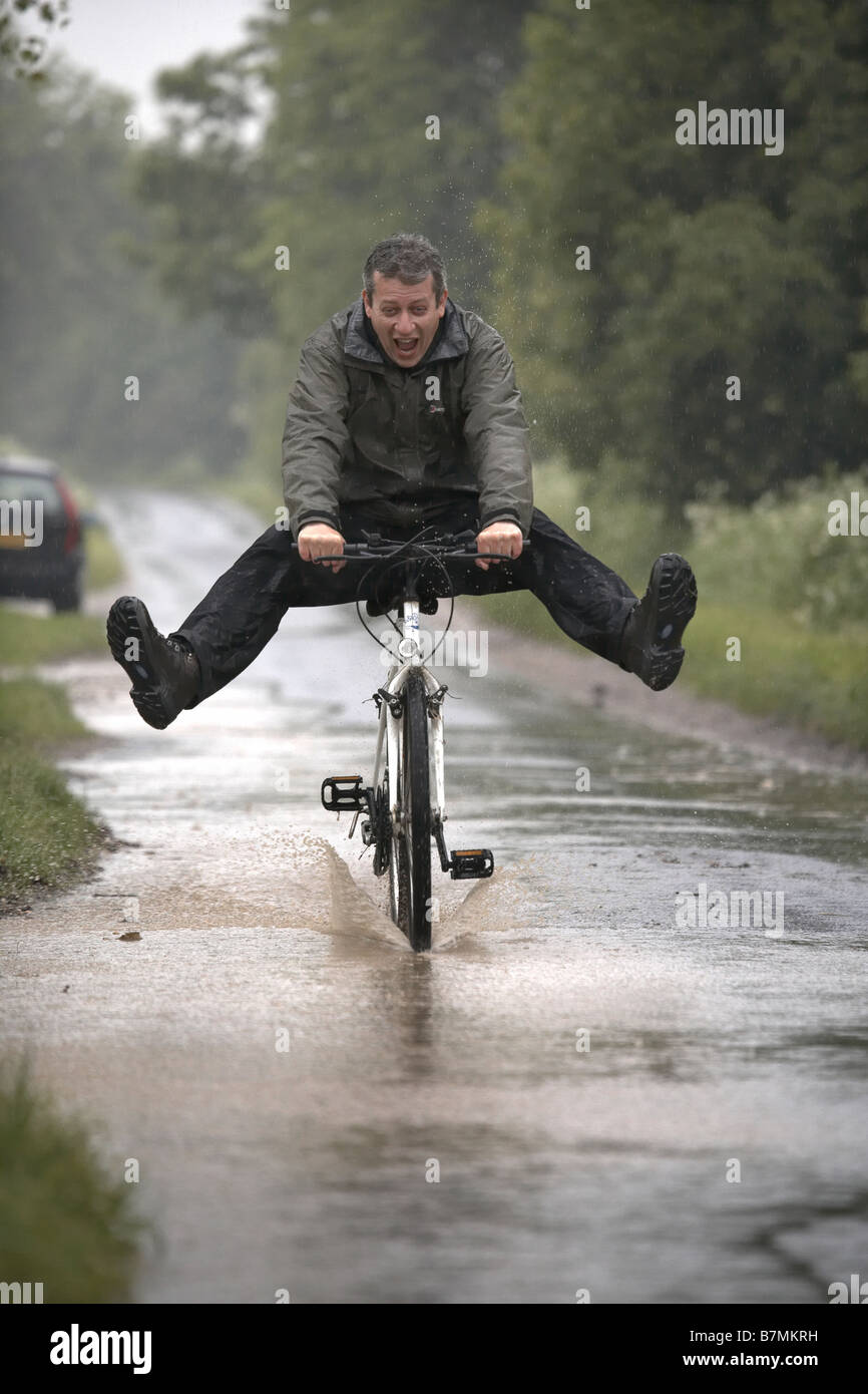 3rd June 2008 Cyclist in the heavy rain near Hull East Yorkshire Stock Photo