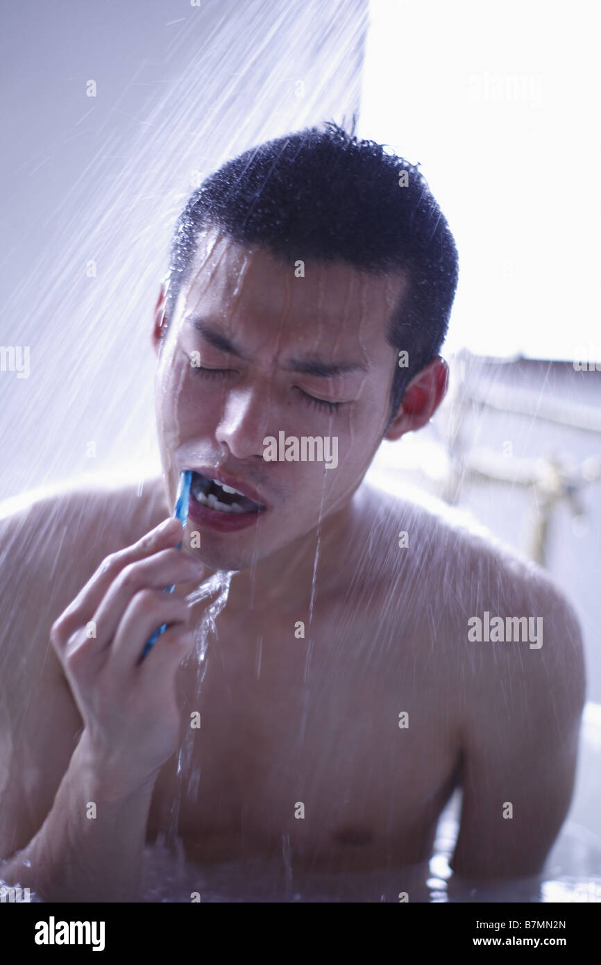 Man Who Sitting Under Shower Brushing His Teeth Stock Photo Alamy