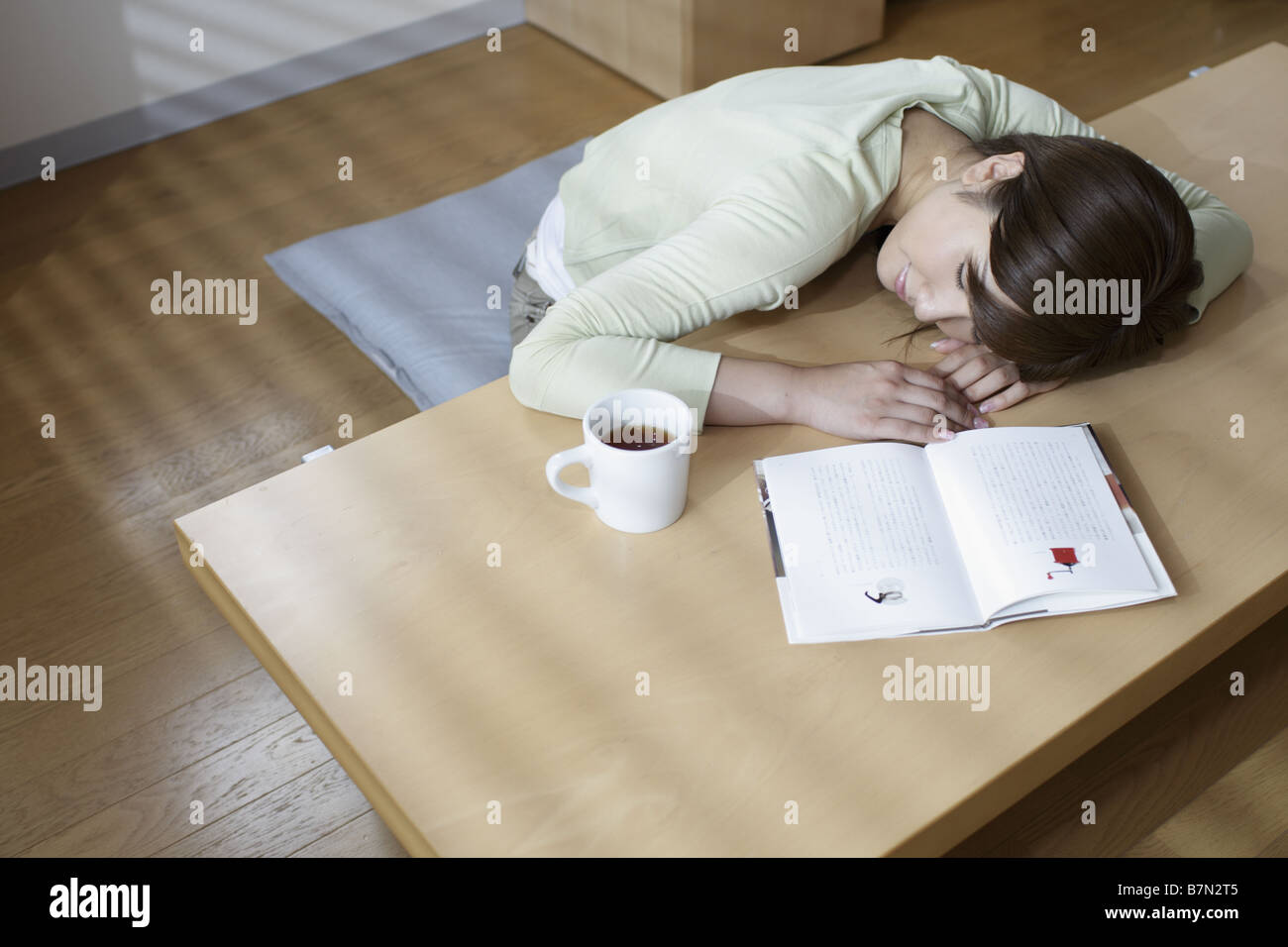Woman Asleep at Her Desk Stock Photo - Alamy