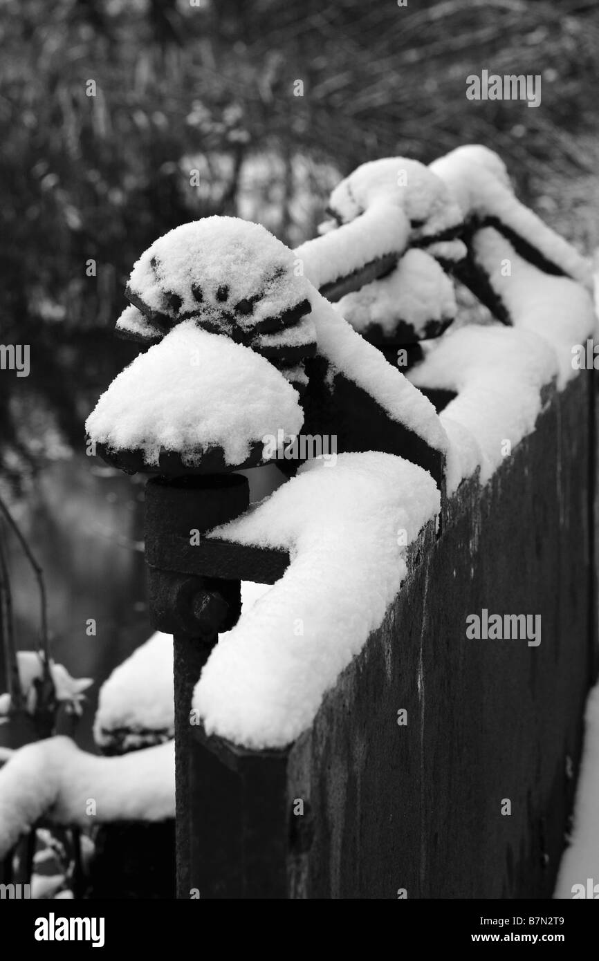 Frost and snow on 'Sluice Gate' gear wheels in Norfolk, Great Britain Stock Photo