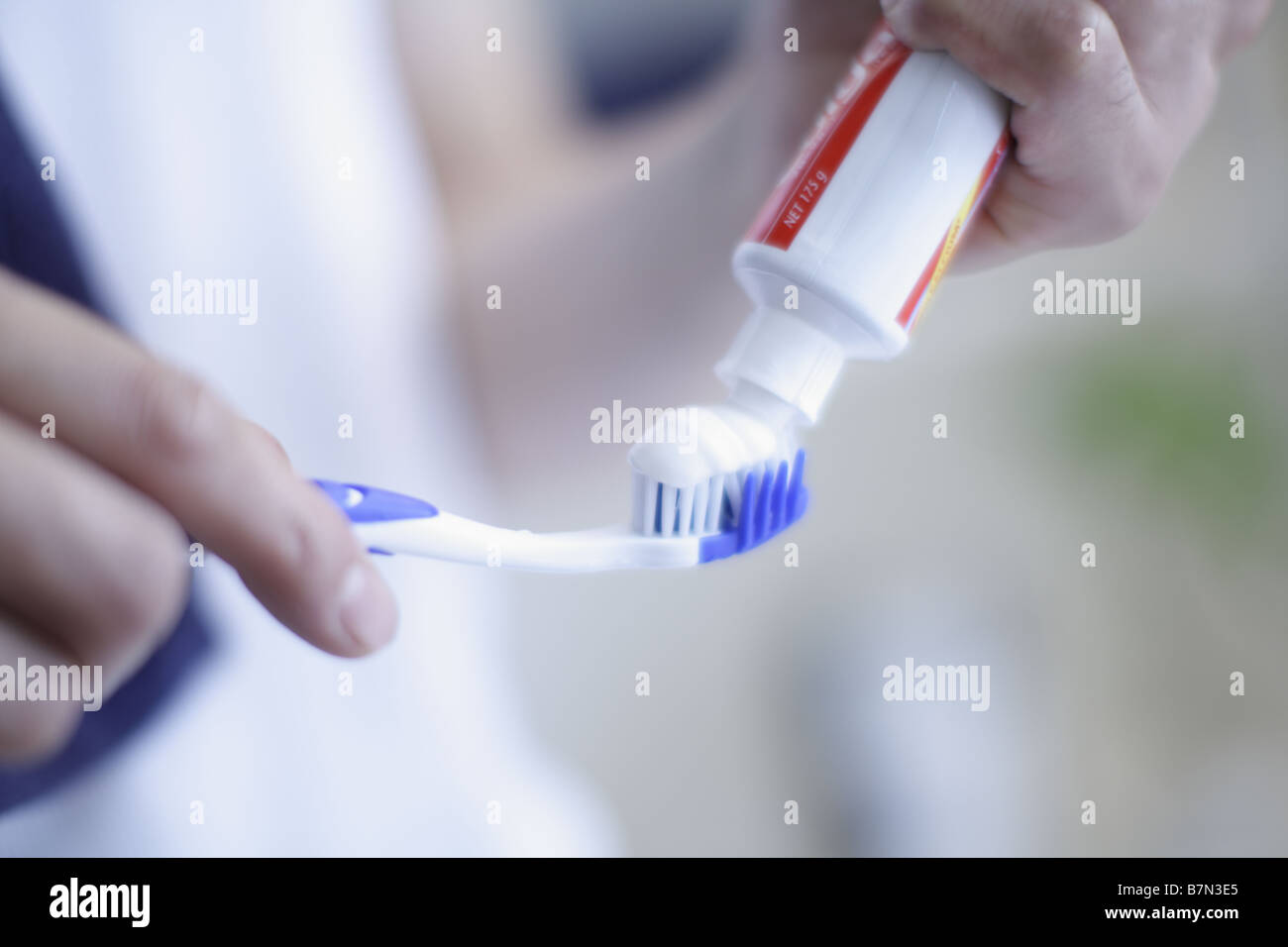 Man Putting Toothpaste on Toothbrush Stock Photo Alamy