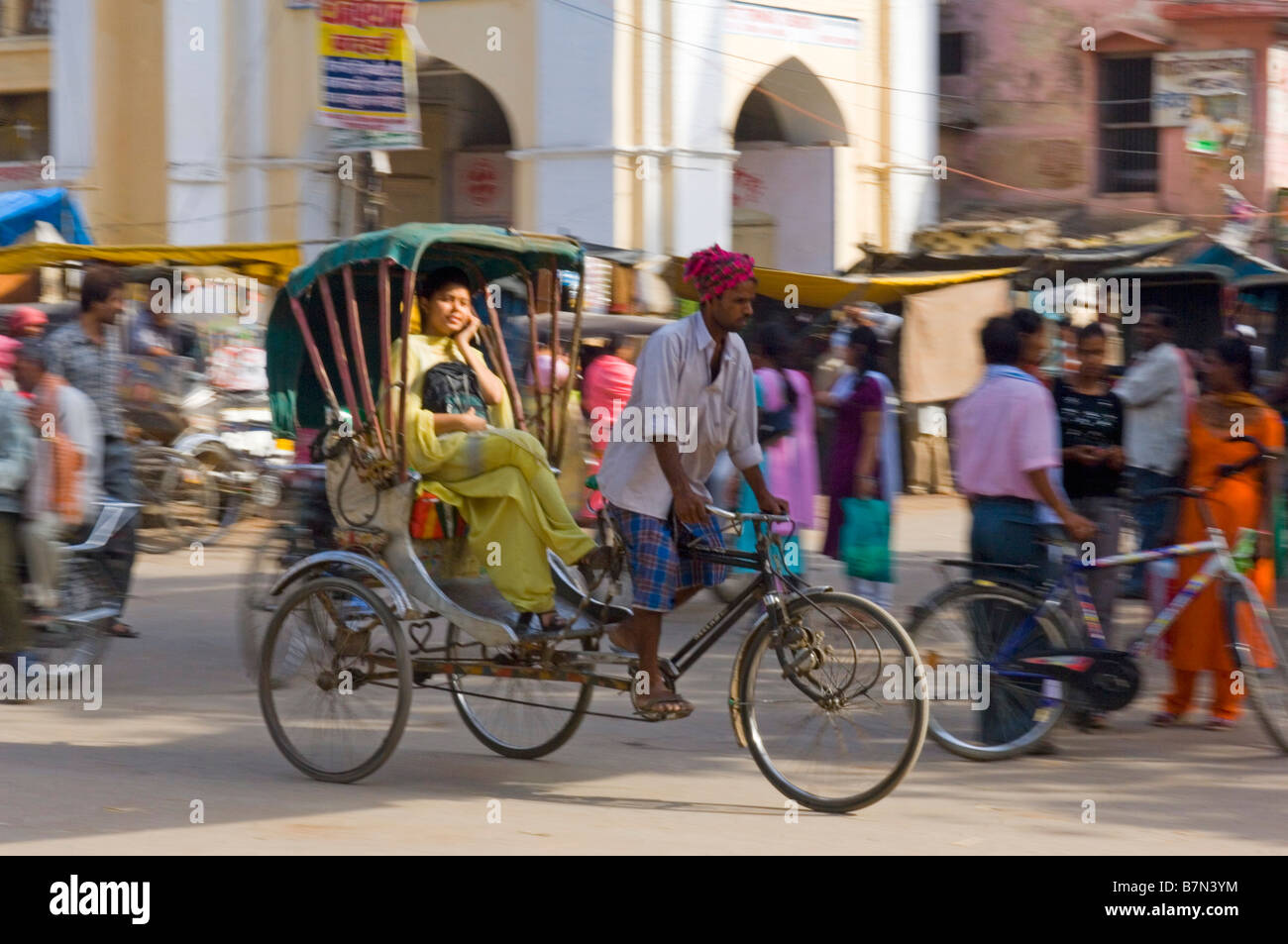 An Indian women on a cycle rickshaw in Varanasi speaking on her mobile ...