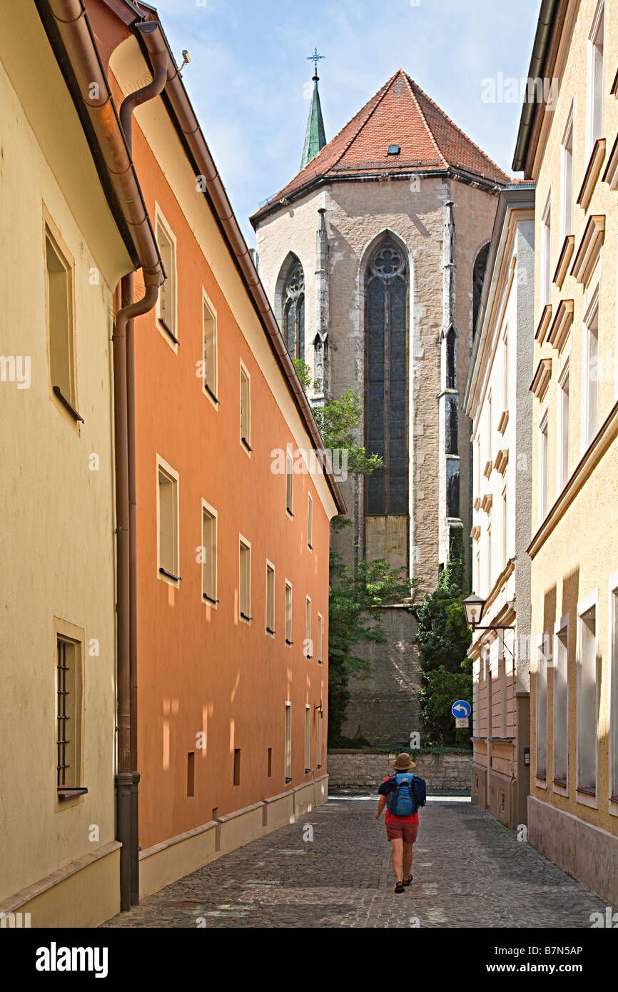 Walker tourist exploring side streets in Regensburg Germany Stock Photo