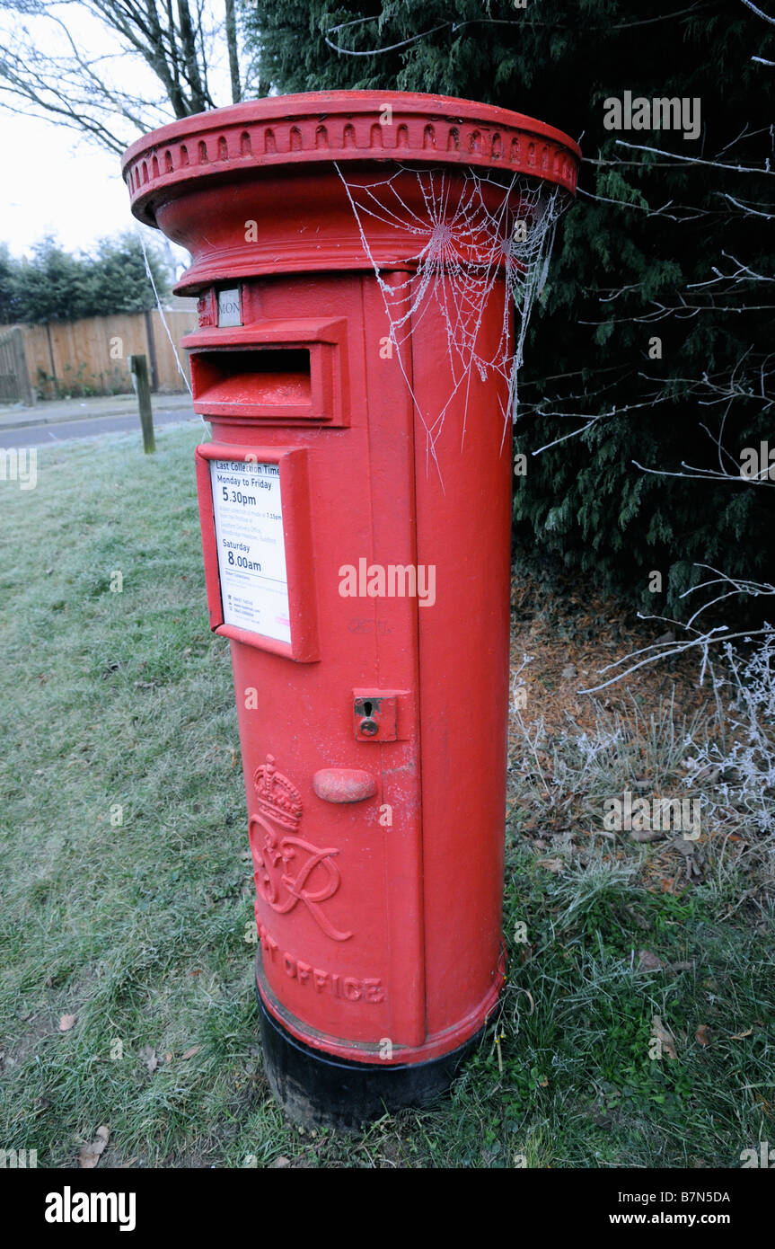 Frosty cobwebs hang off a pillar box in Surrey, England. Stock Photo