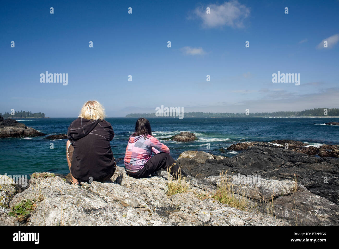 BRITISH COLUMBIA - Enjoying the view of Half Moon Bay in Pacific Rim National Park Reserve. Stock Photo