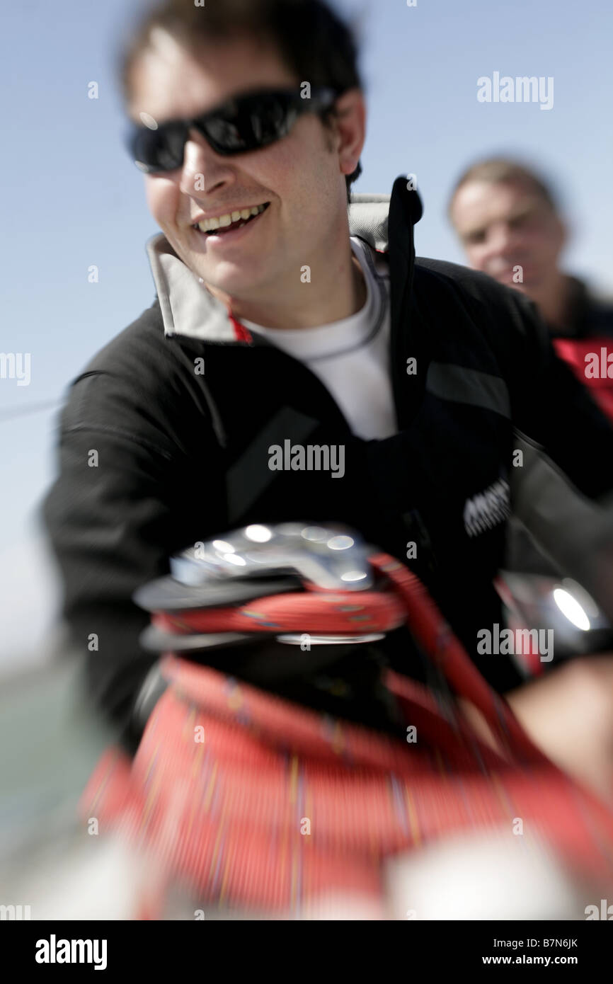 2 male sailors sailing a yacht Stock Photo