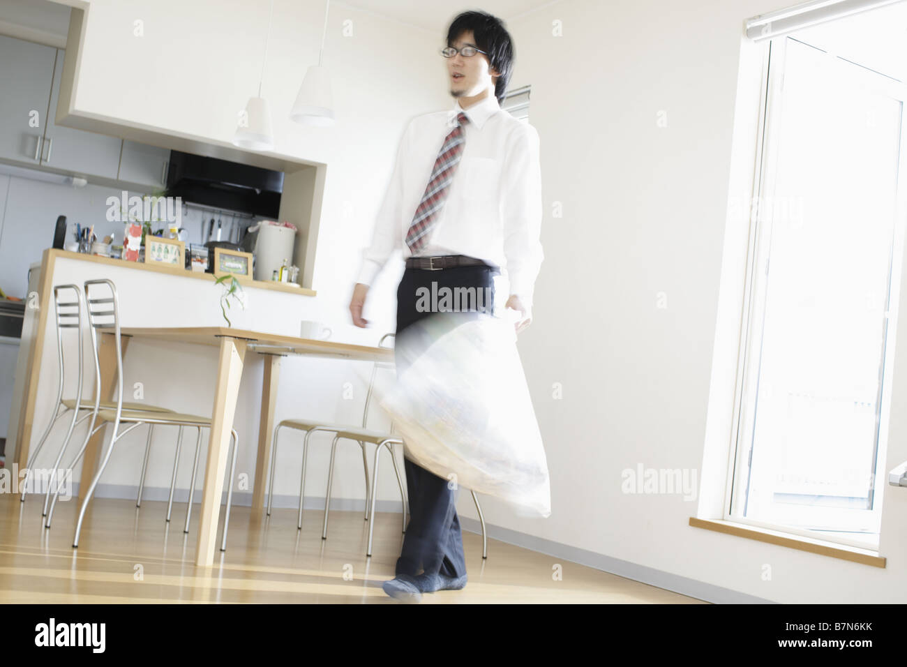 Businessman With Bin Bag Walking Stock Photo