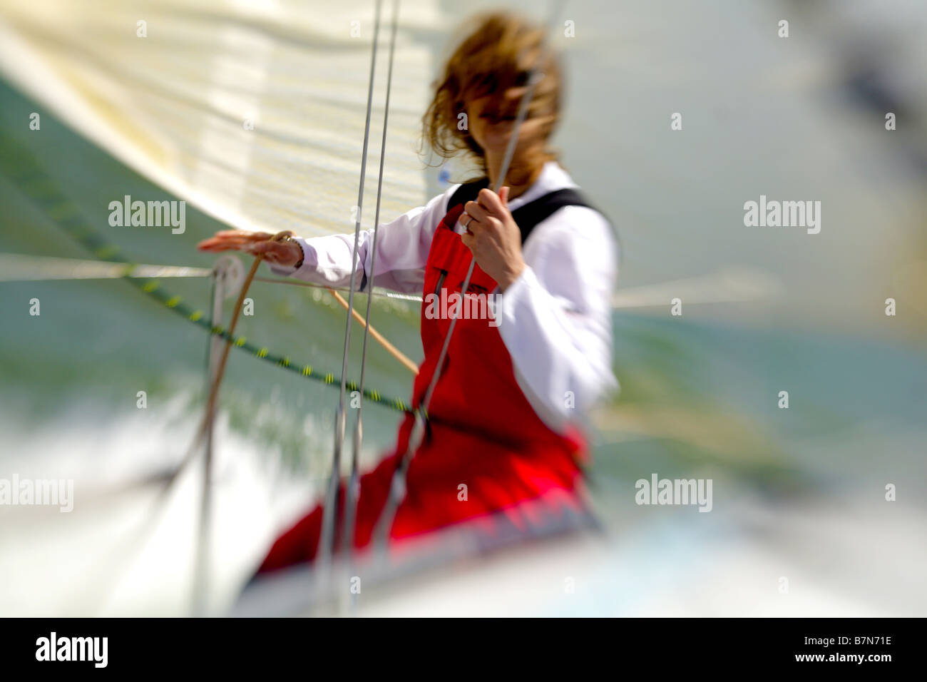 solo sailor skippering a racing yacht in the Uk Stock Photo