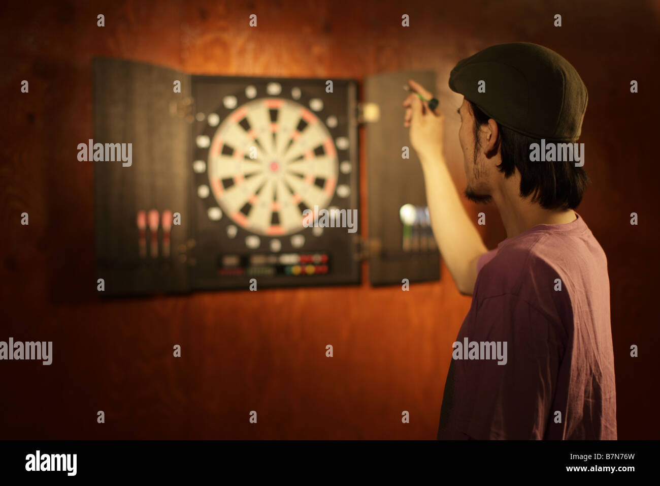 Man Throwing a Dart Stock Photo