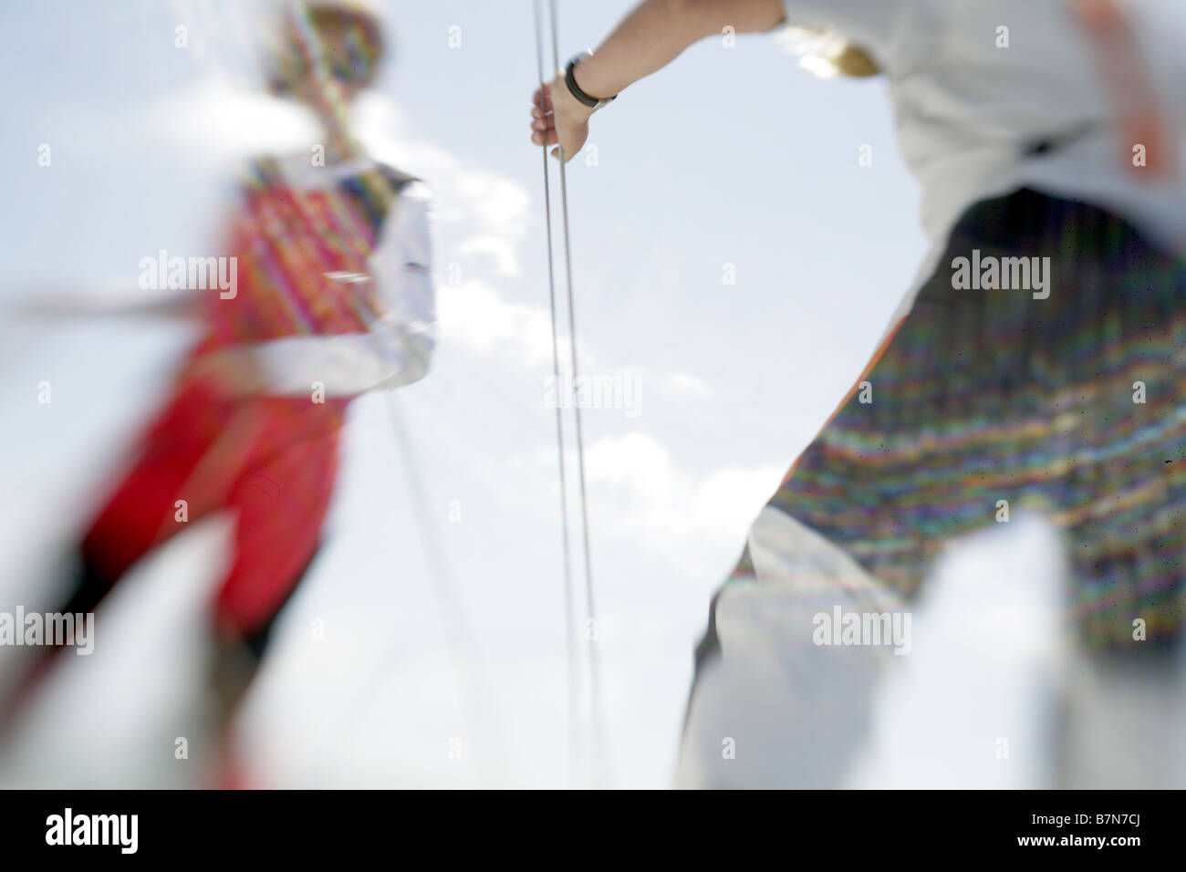 Abstract view of 2 female sailors sailing a yacht Stock Photo