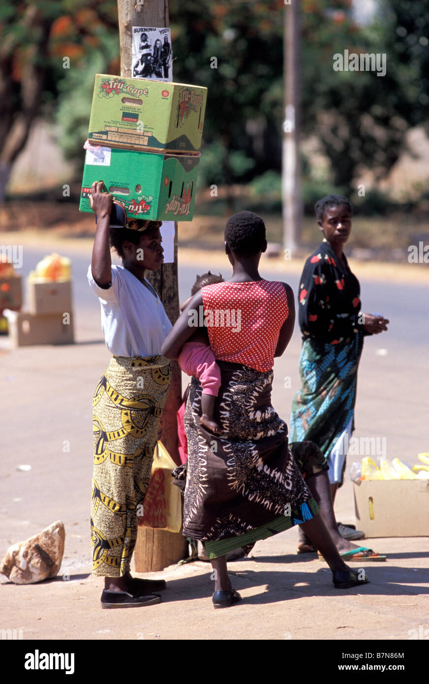 Zambia Lusaka, women with boxes on head Stock Photo