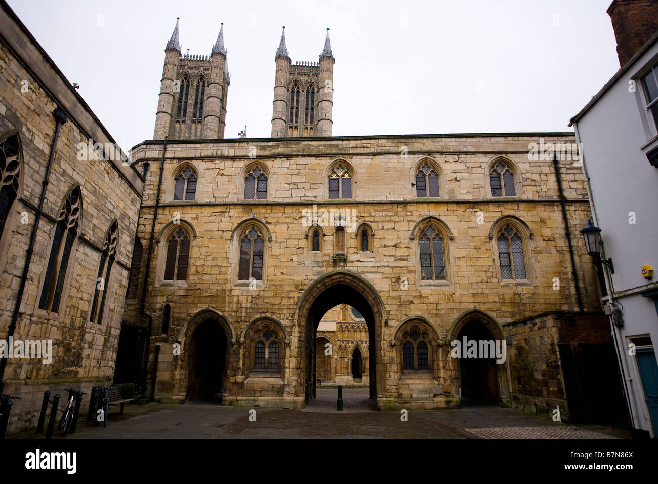 The towers of Lincoln Cathedral behind Exchequer Gate, England. Stock Photo