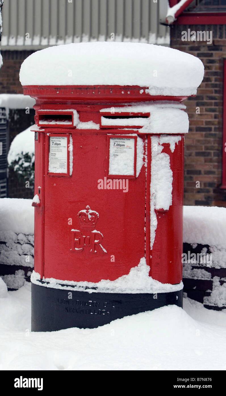 Snow Scenes in the Docklands Area of London February 2009 Red Post Box
