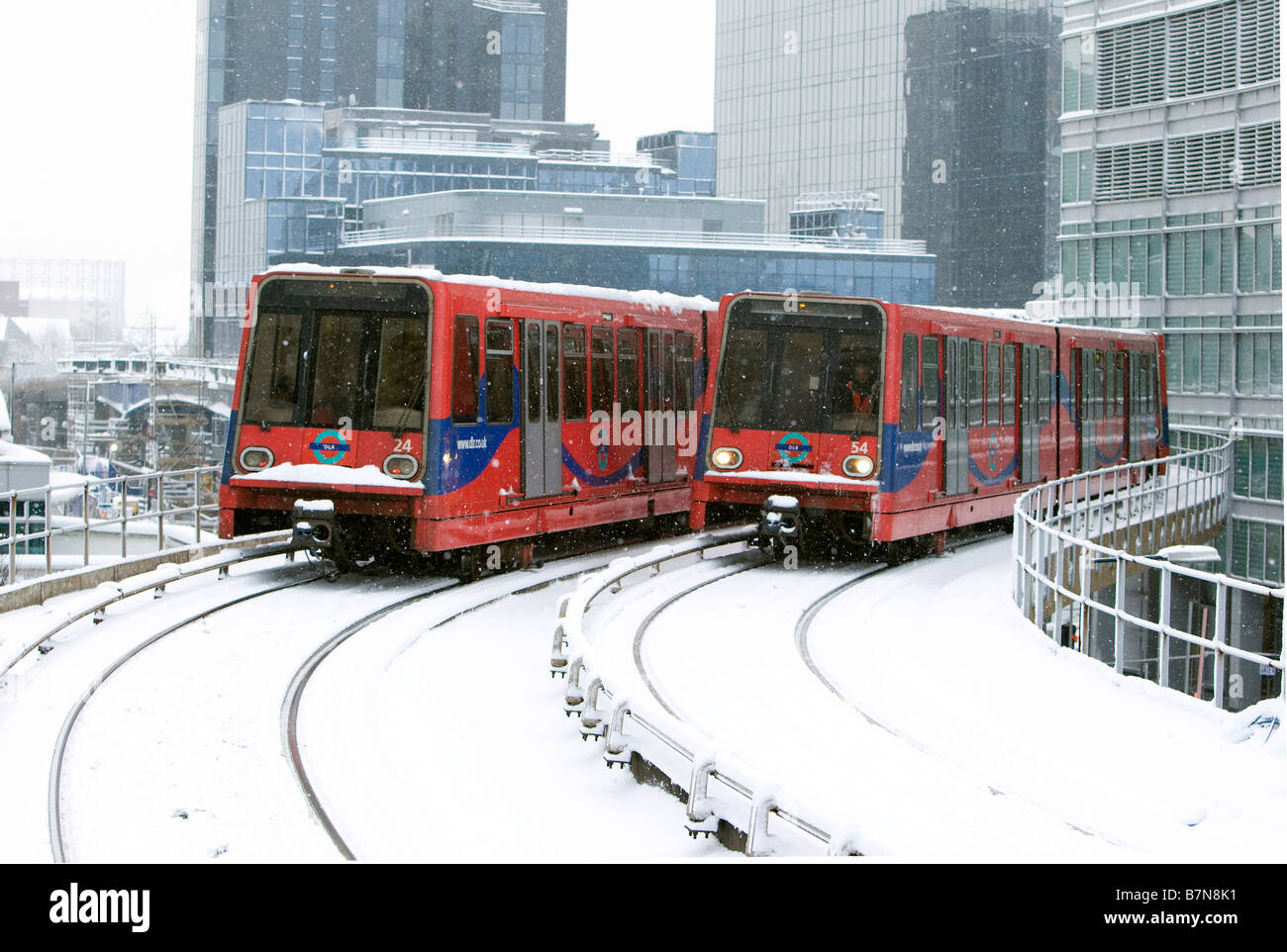 Snow Scenes in the Docklands Area of London February 2009 The DLR Docklands Light Railway near South Quay Station Stock Photo
