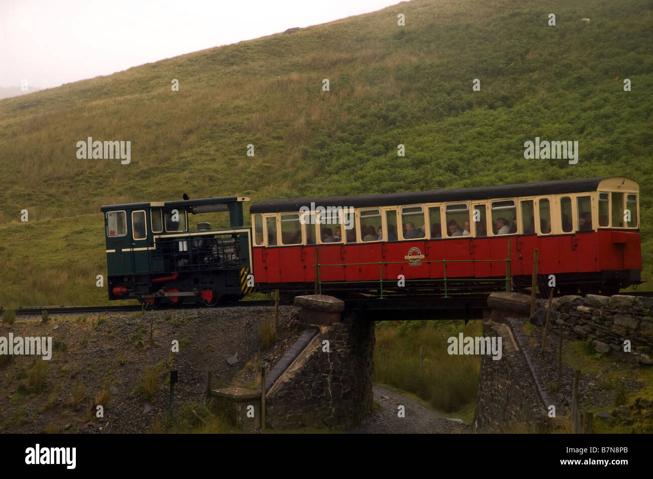 Snowdonia mountain railway train crossing bridge Stock Photo