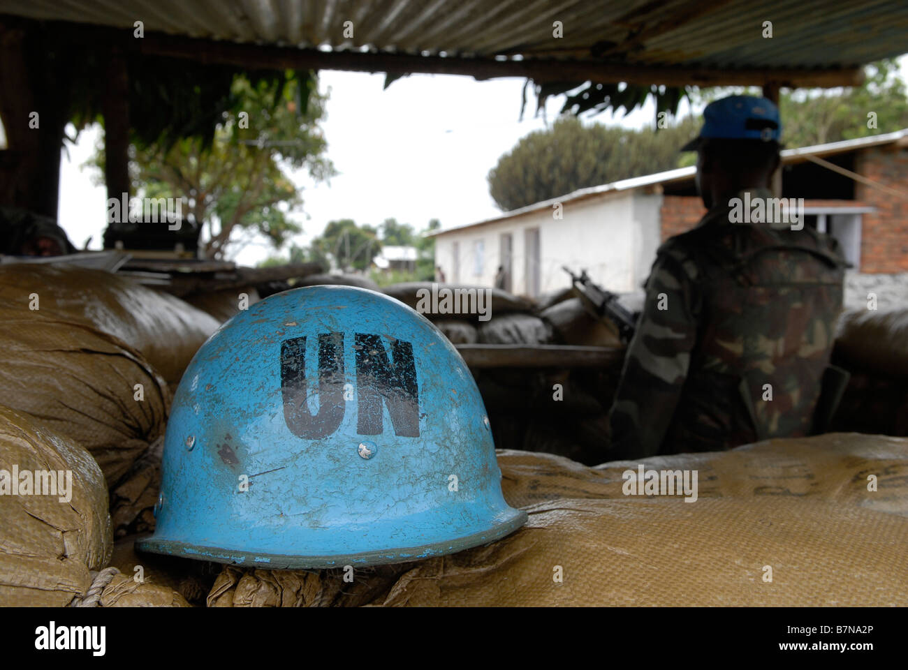 A UN peacekeeper from India serving with Monusco a United Nations peacekeeping force stands guard in a unit position in North Kivu province DR Congo Stock Photo