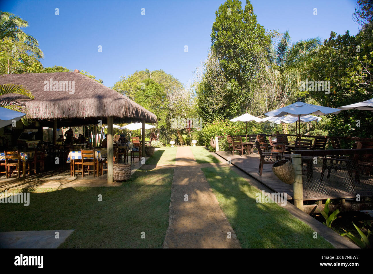 Umbrellas and thatched roofs on openair restaurant in BrazilA Stock Photo