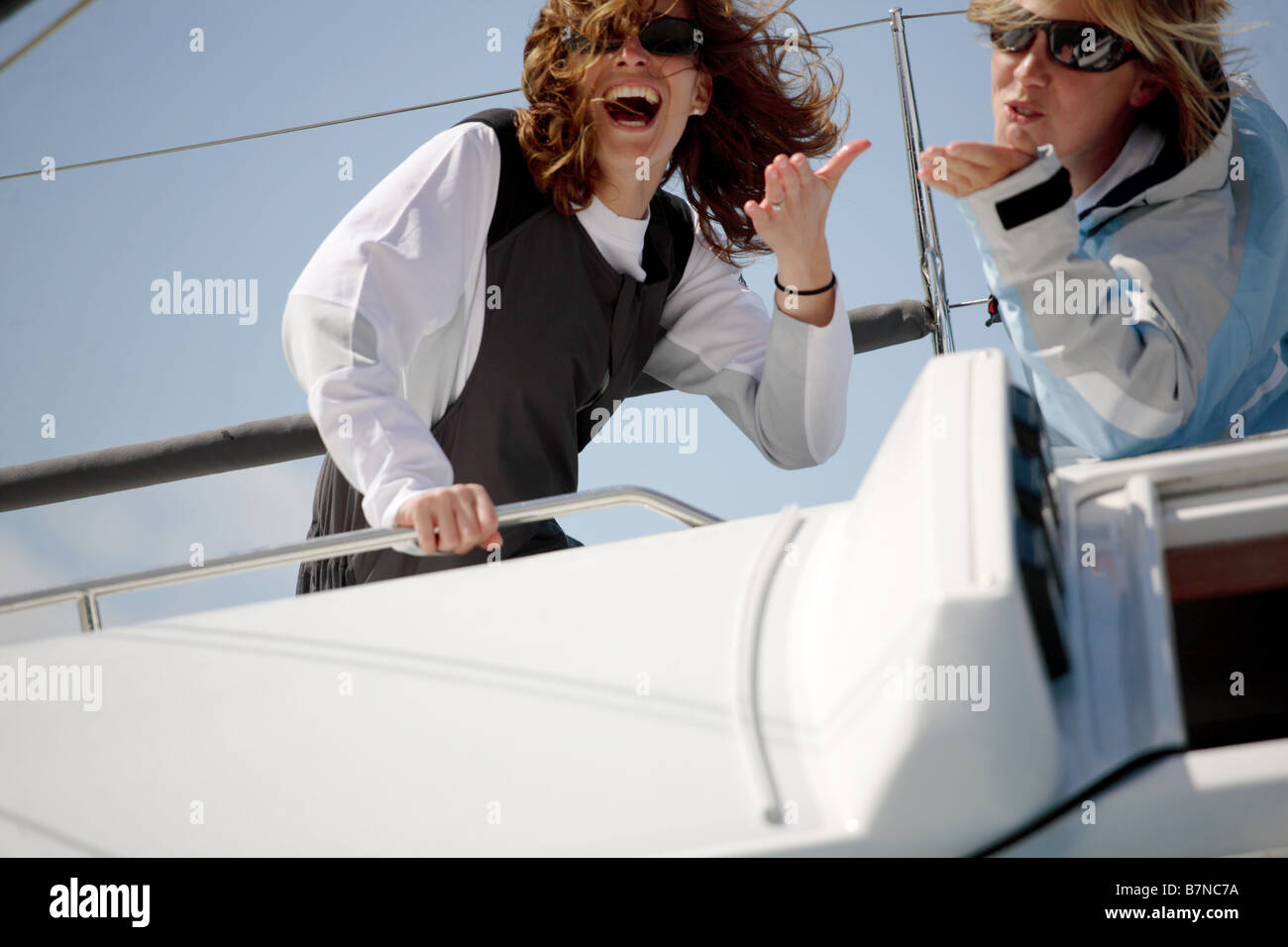 2 female sailors having fun on a Yacht Stock Photo