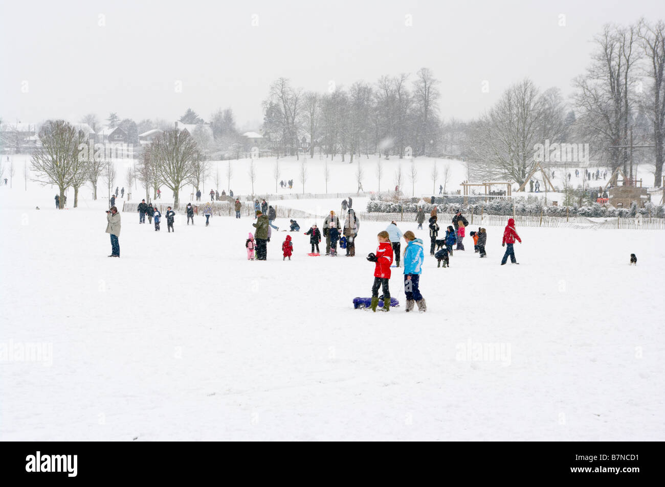 A winter snow scene view Across Priory Park Reigate Surrey In The Snow Stock Photo