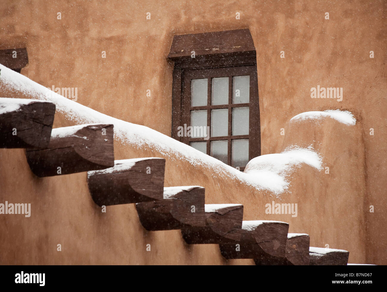 Snow on adobe walls of Santa Fe Stock Photo