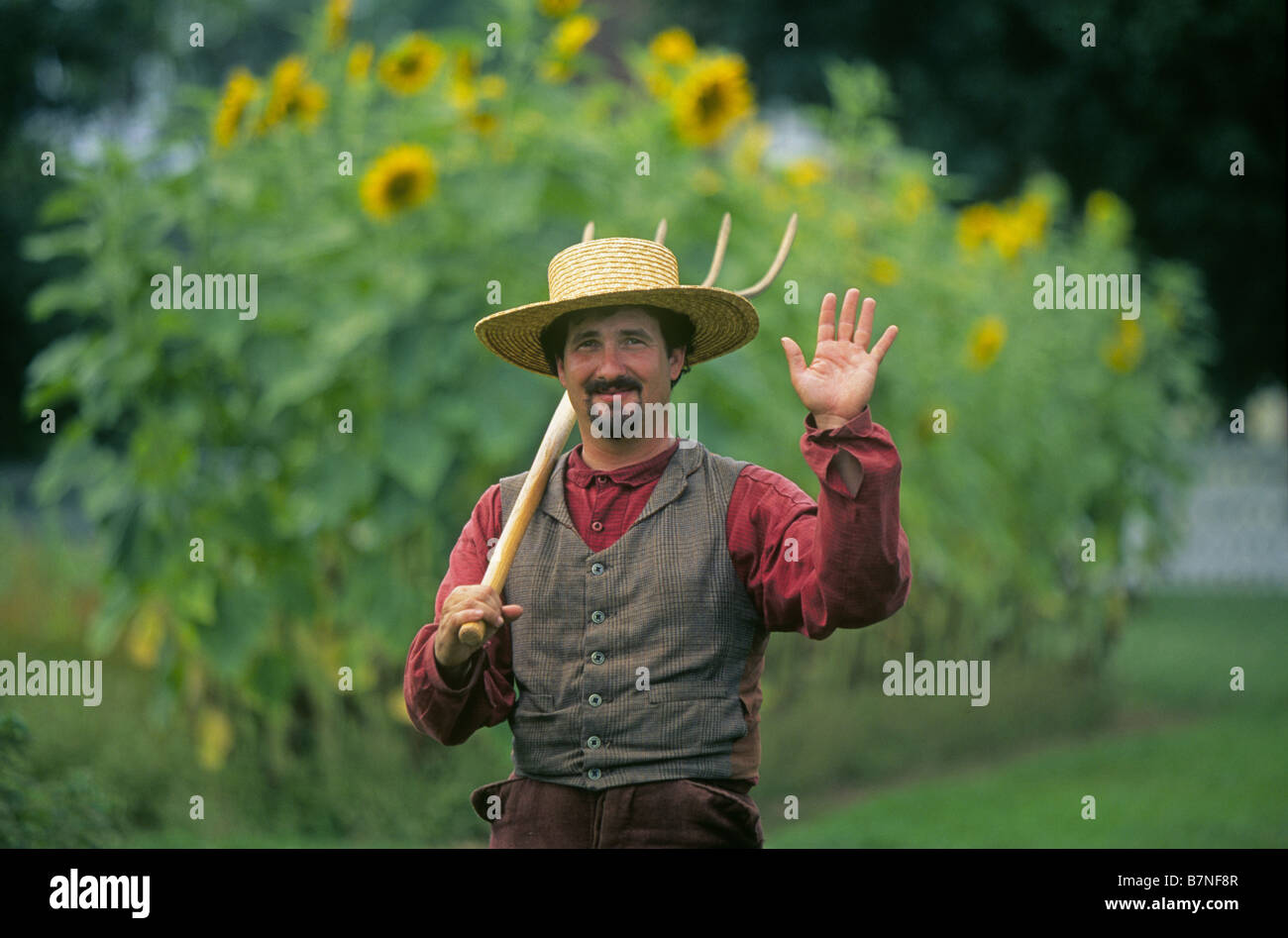 A reenactor dressed in traditional Shaker clothing at Shaker Village at