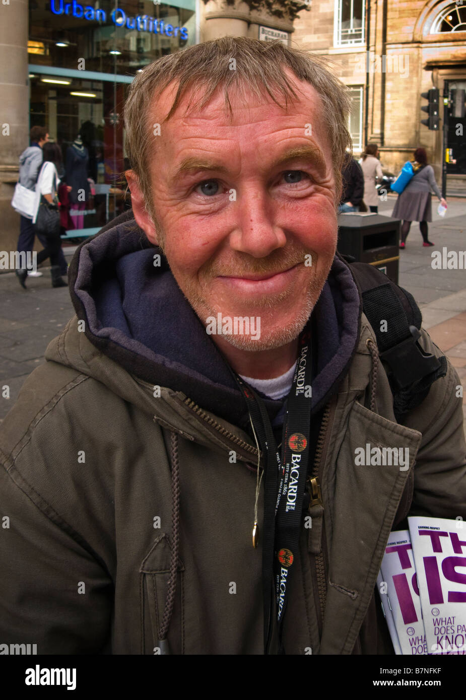 Homeless and unemployed man selling The Big Issue in Buchanan Street Glasgow Scotland United Kingdom Stock Photo