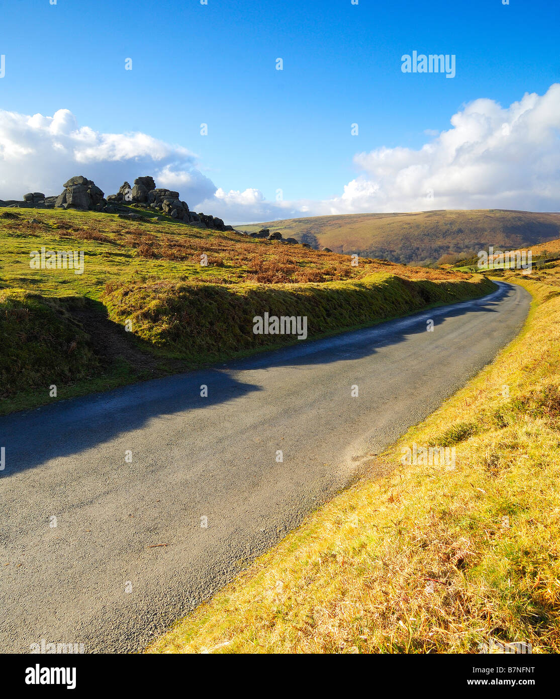 A narrow single track country road near Bonehill Rocks on Dartmoor Stock Photo