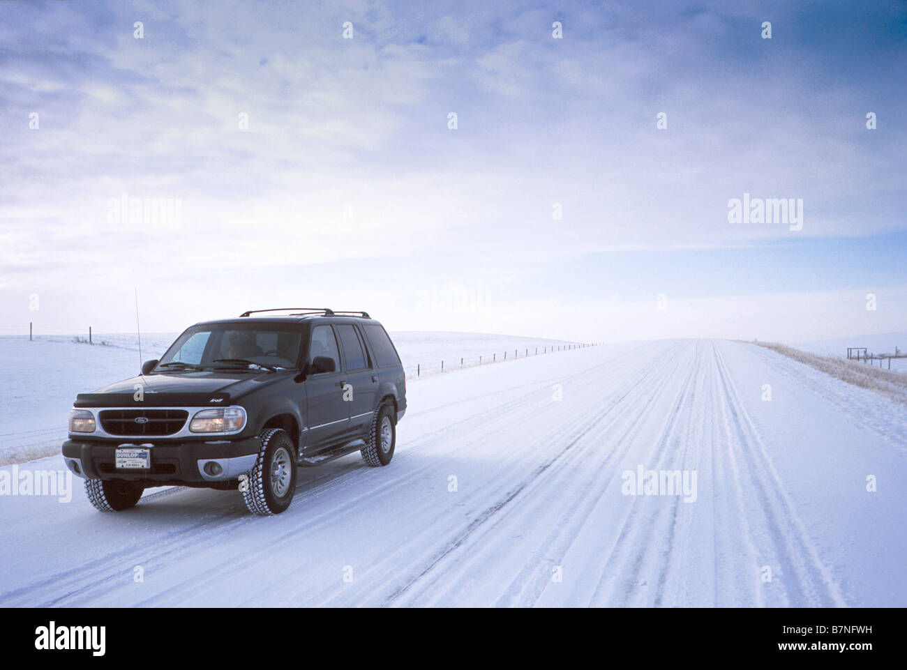 4x4 truck on snow covered road in southern Alberta Canada Stock Photo