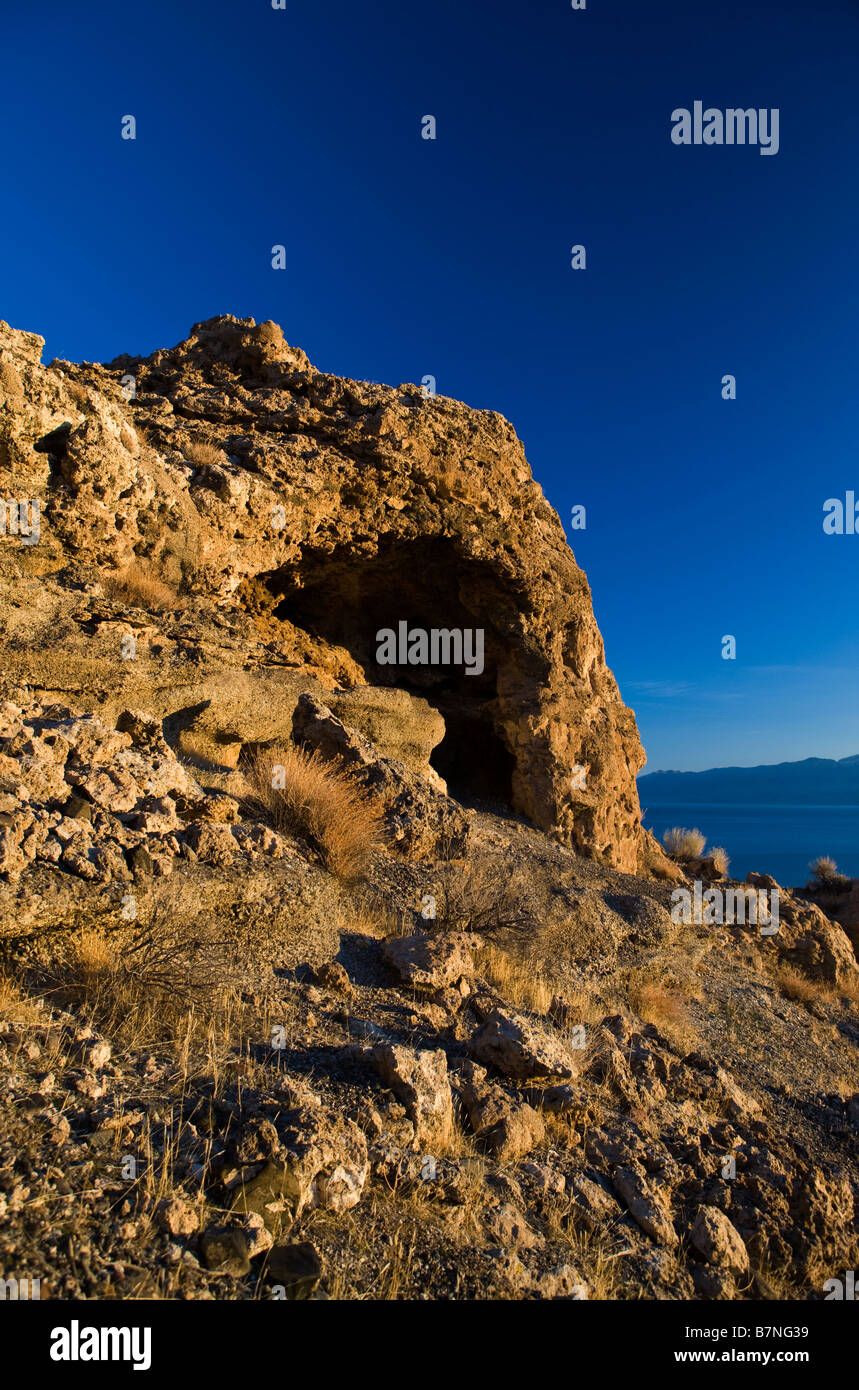 A rock formation with cave at sunrise Pyramid Lake Nevada Stock Photo