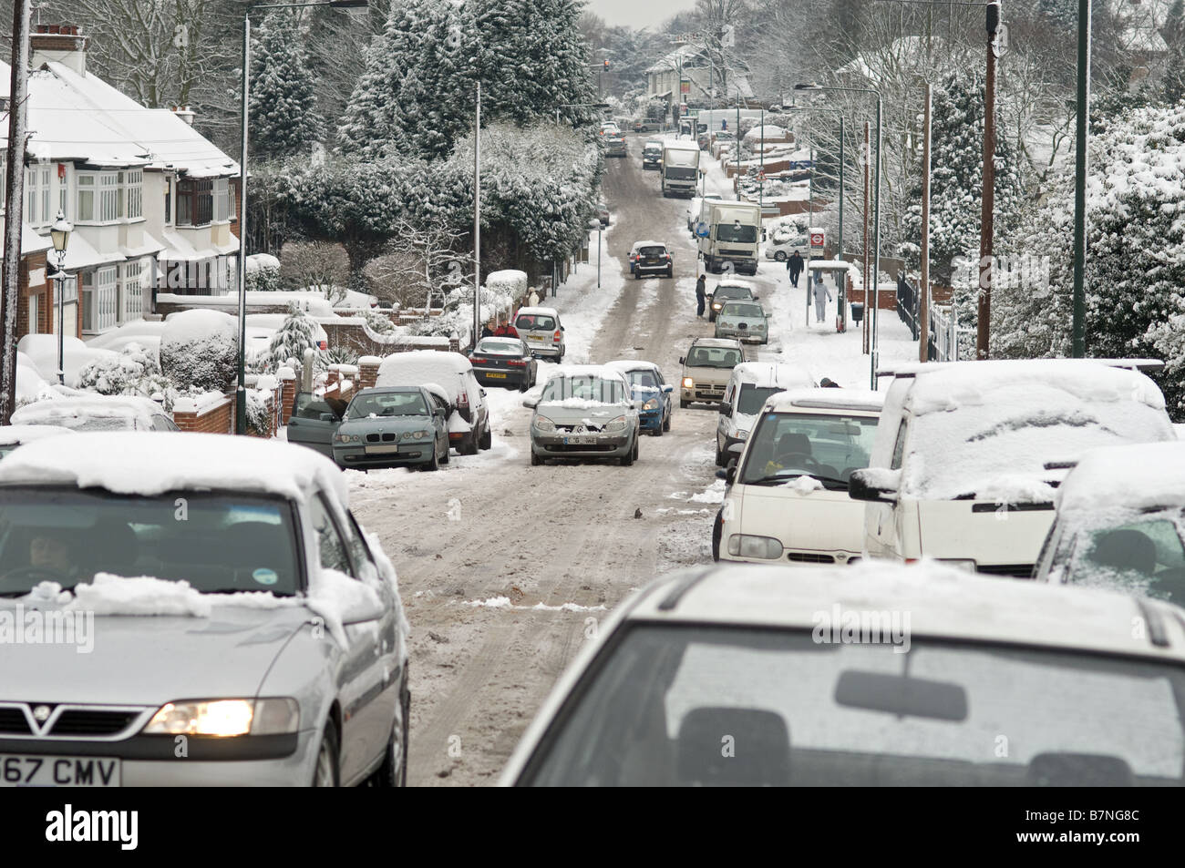 traffic in snow on hill, road not gritted Stock Photo