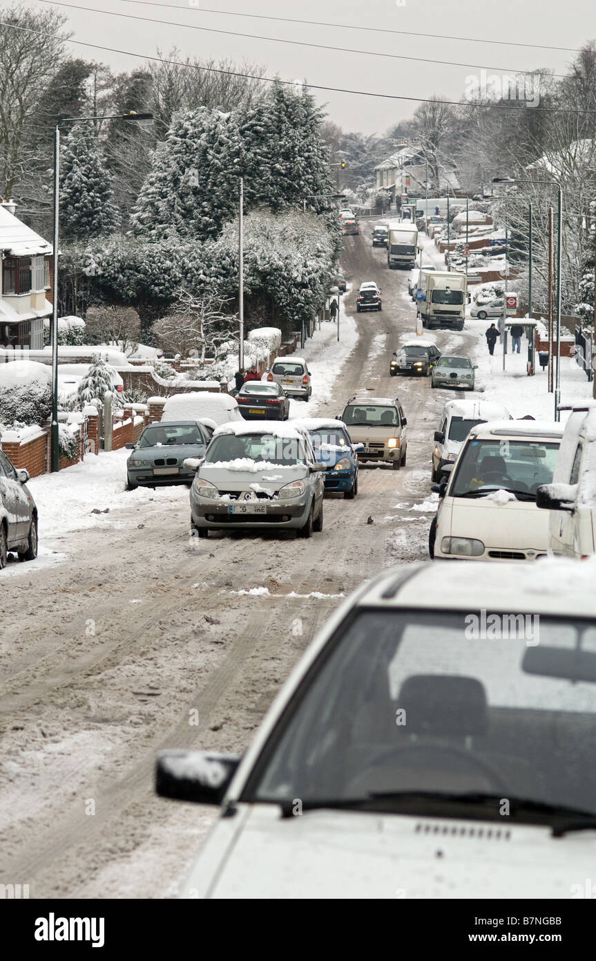 traffic in snow on hill, road not gritted Stock Photo