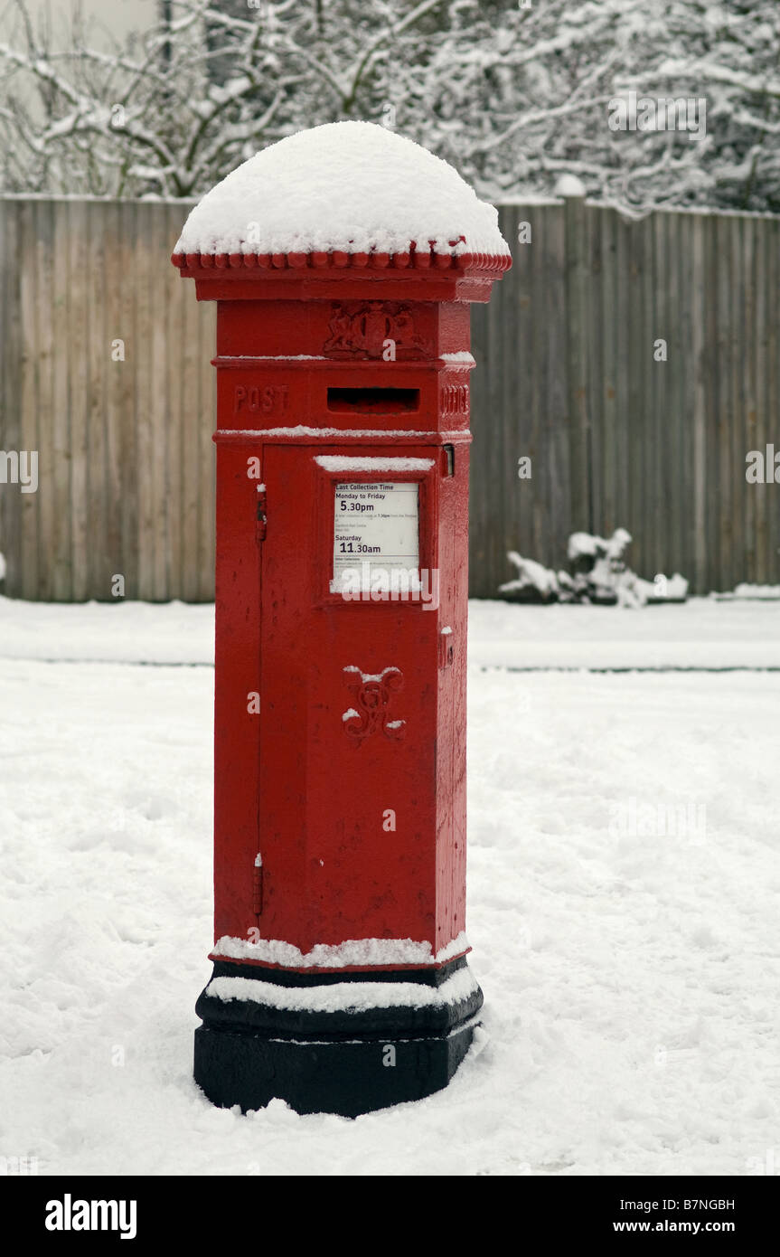 Snow covered victorian post box Stock Photo