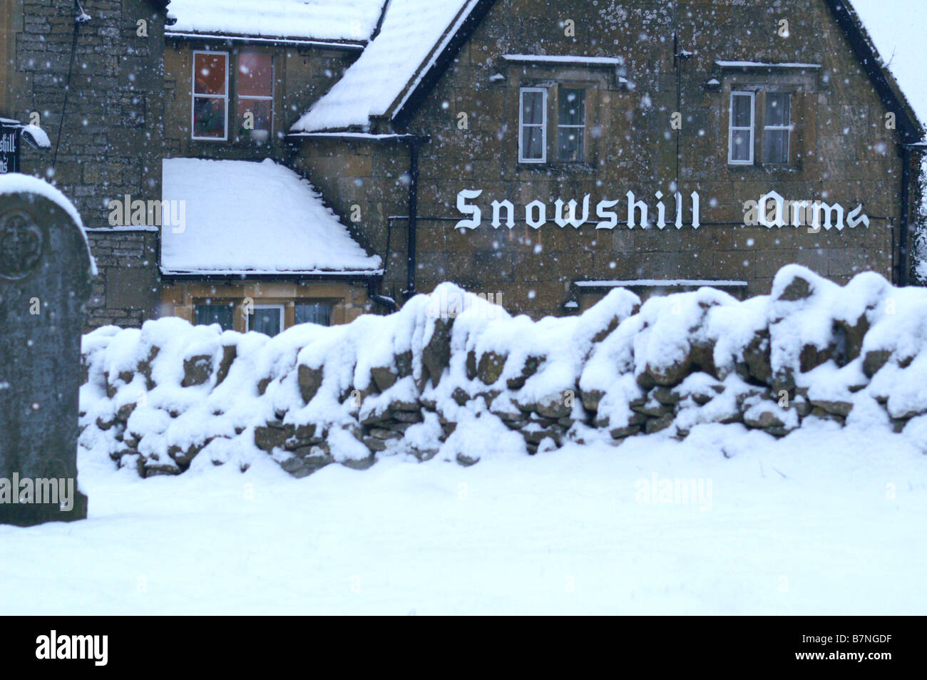 Snowshill Arms pub in Snowhill village during blizzard. February 2009. Midlands UK Stock Photo